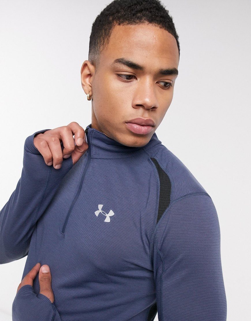 A picture of a navy Under Armour running jacket. Available at ASOS.