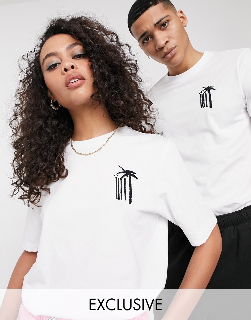 A picture of a male and female model wearing a white T-shirt featuring a hand-embroidered palm tree design from ASOS' new Made In Kenya collection. Available now.