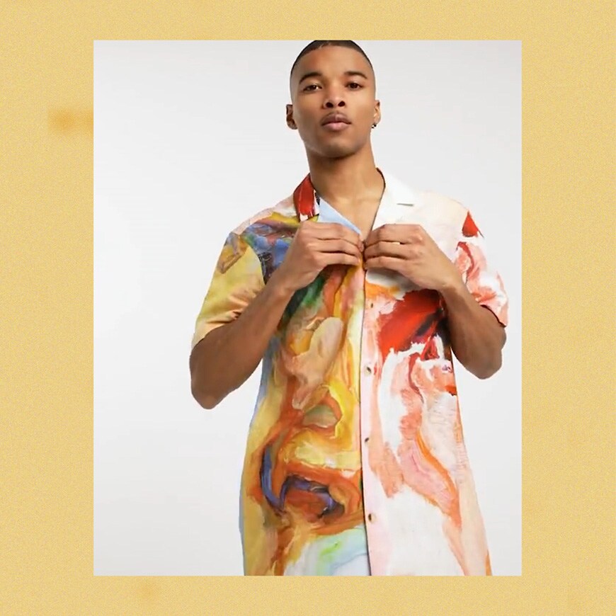 A picture of a model wearing a bright, multicoloured watercolour-print shirt. Part of our 5 best date -night shirts. Available now. 