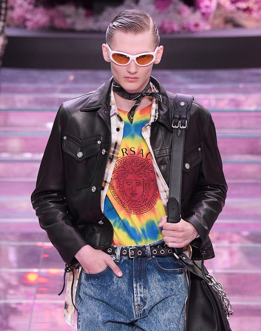 A picture of a model wearing a tie-dye T-shirt on the Versace catwalk during Fashion Week.
