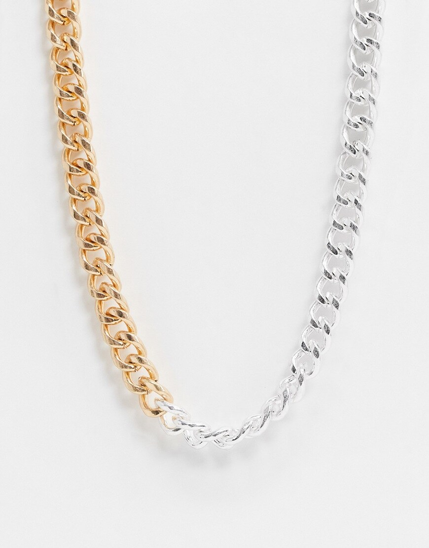 A picture of a chunky chain necklace made of both gold and silver-tone metal. Available now.