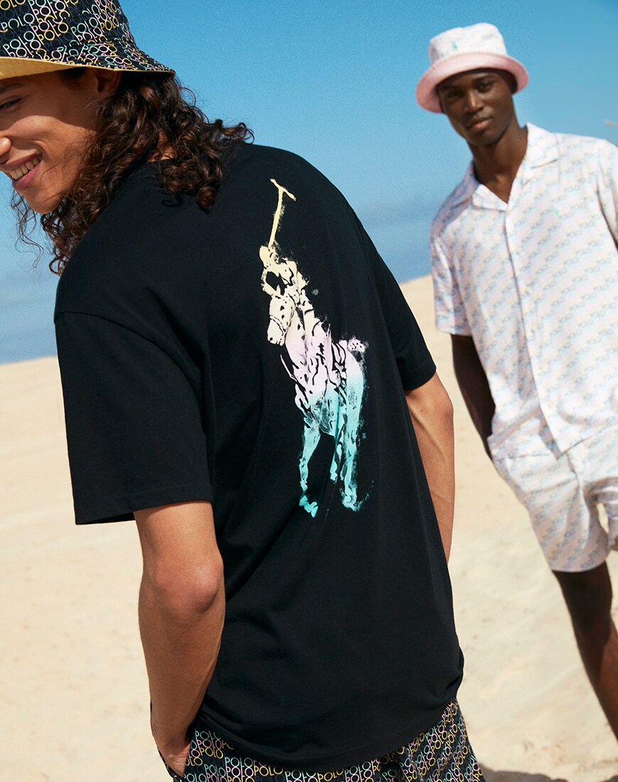 A picture of two models wearing shorts, T-shirts and hats form the new and exclusive Polo Ralph Lauren collaboration. Available now.