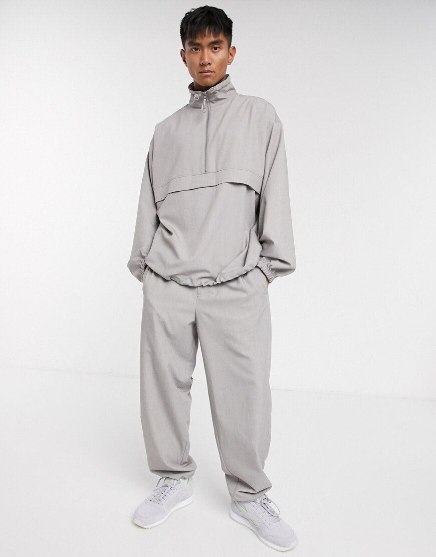 A picture of a man wearing a grey tracksuit in nylon by ASOS WHITE | ASOS STYLE FEED