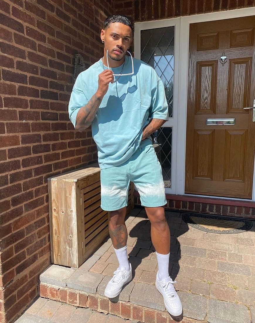A picture of a man wearing a teal T-shirt and shorts co-ord. Available at ASOS | ASOS Style Feed
