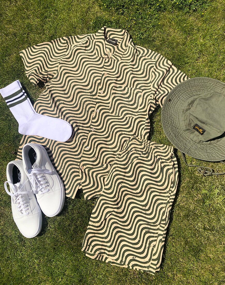 A picture of a printed shirt and shirts co-ord with a matching safari hat, sport socks and Vans Old Skool trainers. Available at ASOS | ASOS Style Feed
