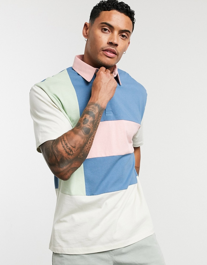 A picture of a model wearing a relaxed polo shirt featuring pastel cut-and-sew details. Available at ASOS | ASOS Style Feed