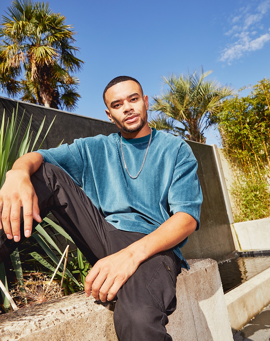 A picture of TV star Wes Nelson in a cord T-shirt and black cargo trousers by ASOS DESIGN. Part of the new ASOS DESIGN Must-Haves collection | ASOS Style Feed