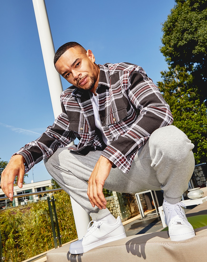 A picture of TV star Wes Nelson wearing a check shirt and grey joggers by ASOS DESIGN and part of the new ASOS DESIGN Must-Haves collection | ASOS Style Feed