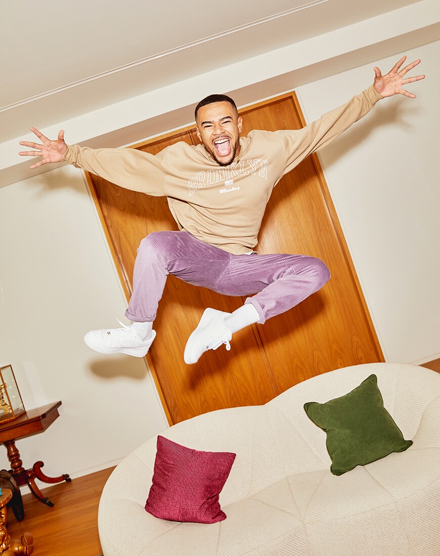 A picture of TV star Wes Nelson wearing a varsity-style sweatshirt and purple cord trousers by ASOS DESIGN. Part of the new ASOS DESIGN Must-Haves collection | ASOS Style Feed