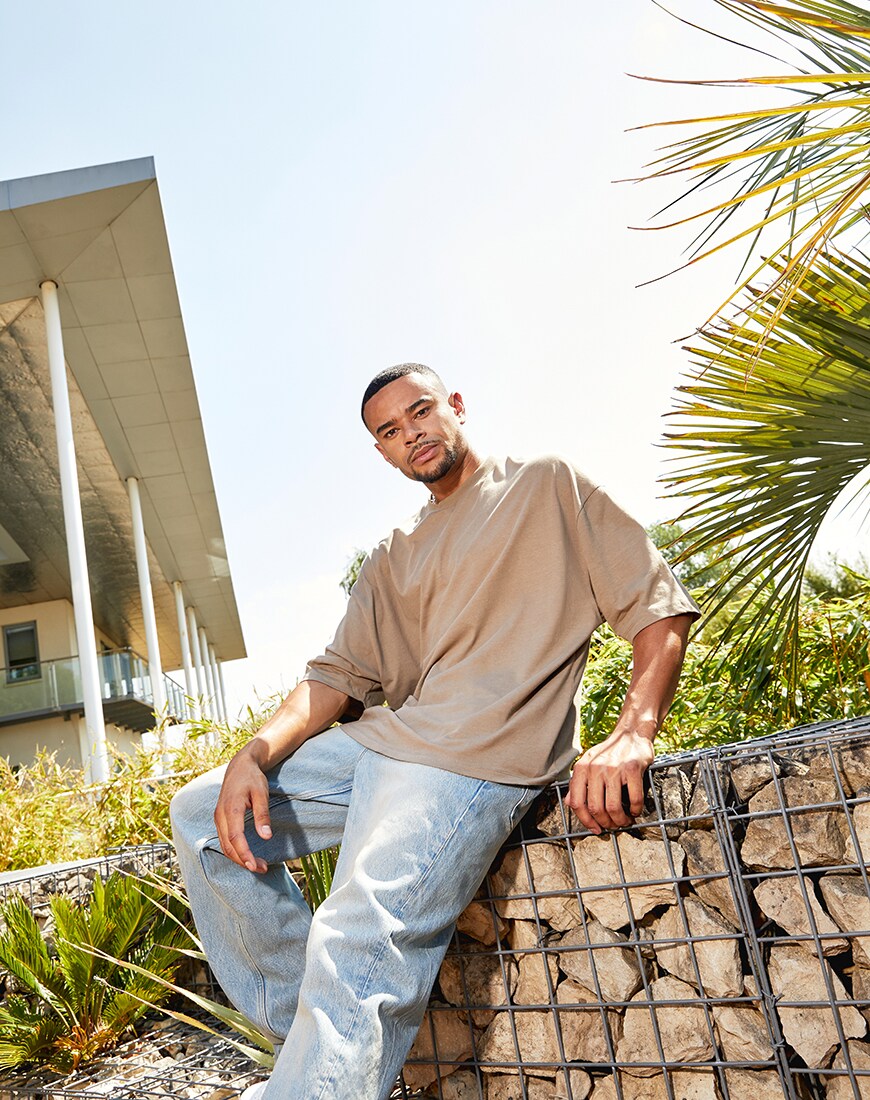 A picture of TV star Wes Nelson wearing an oversized T-shirt and baggy-fit jeans by ASOS DESIGN. Part of the new ASOS DESIGN Must-Haves collection. Available at ASOS.