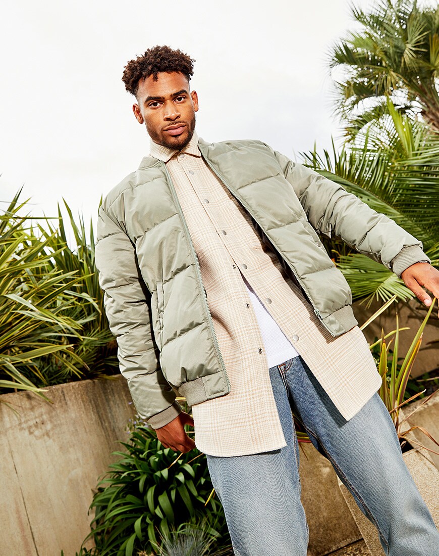 A picture of TV star Jordan Hames wearing a padded bomber jacket, an oversized check shirt and blue jeans from the new ASOS DESIGN Must-Haves collection. Available at ASOS | ASOS Style Feed