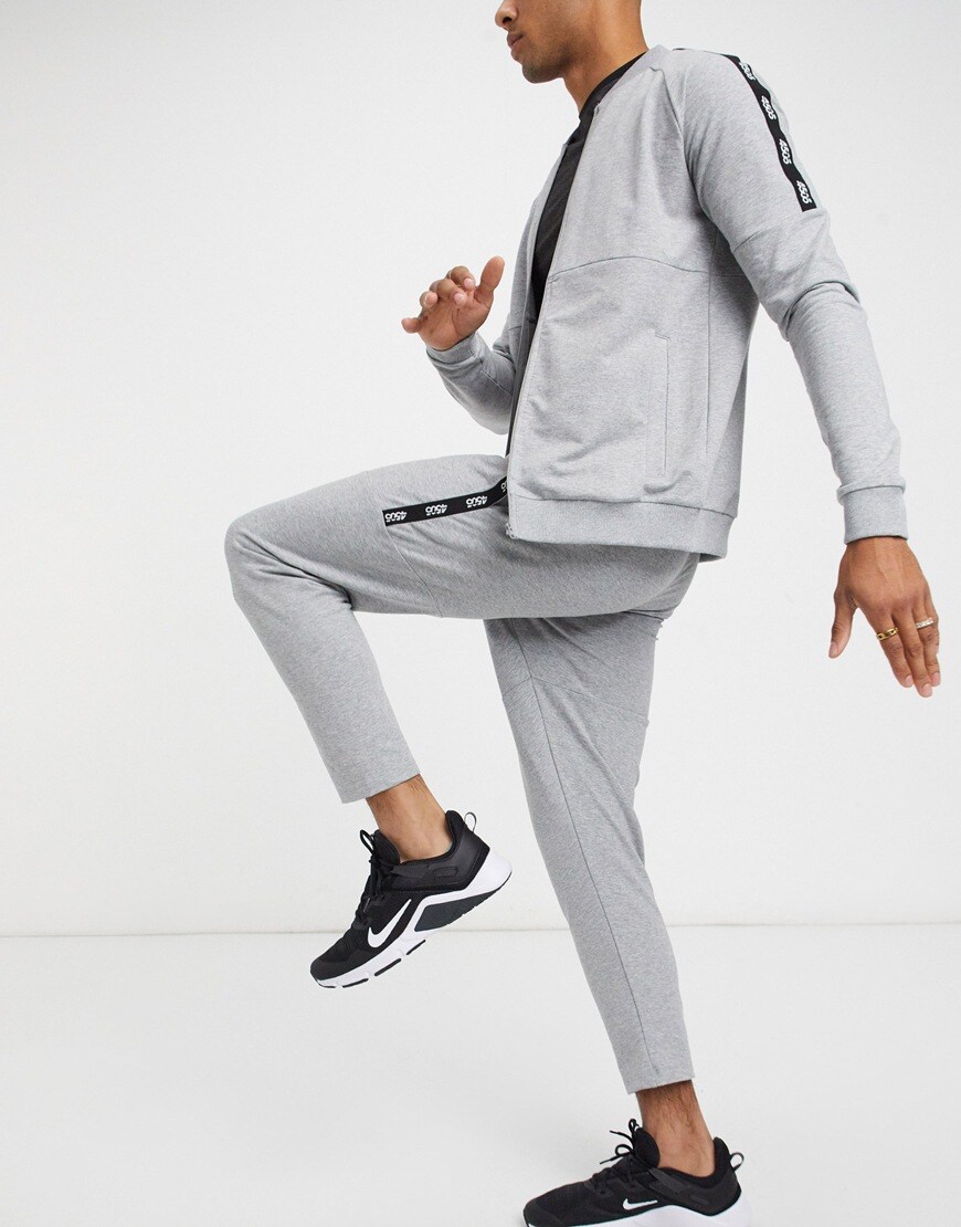 A picture of a model wearing a pair of grey super skinny joggers by ASOS 4505. Available at ASOS.