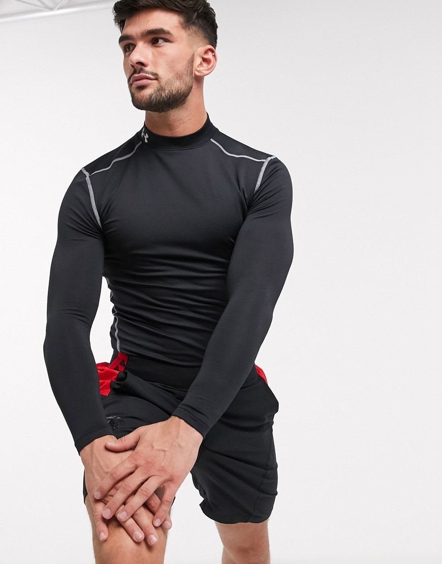 A picture of a model wearing a black top from the Under Armour ColdGear range. Available at ASOS.