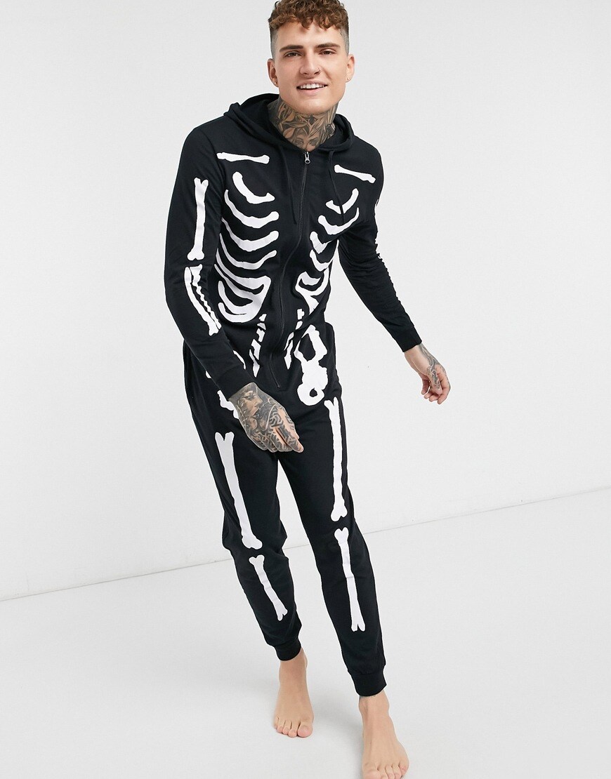  A picture a model wearing a black skeleton onsie. Available at ASOS | ASOS Style Feed