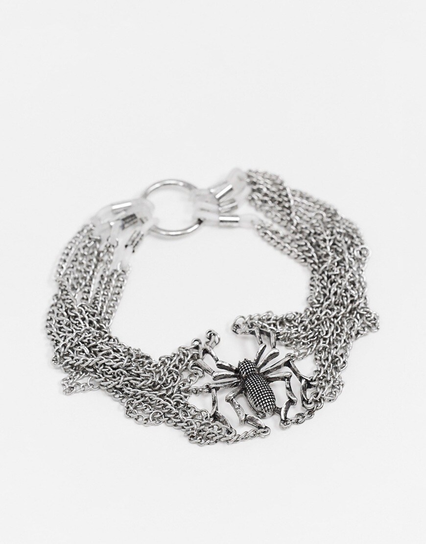 A picture of a silver-tone spider bracelet. Available at ASOS |ASOS Style Feed