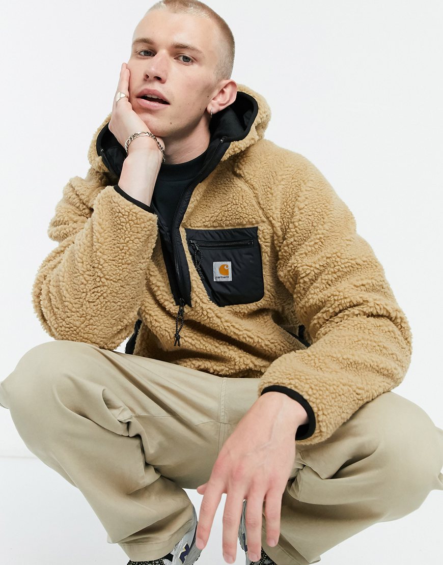 An image of a man wearing a beige jacket by Carhartt | ASOS Style Feed