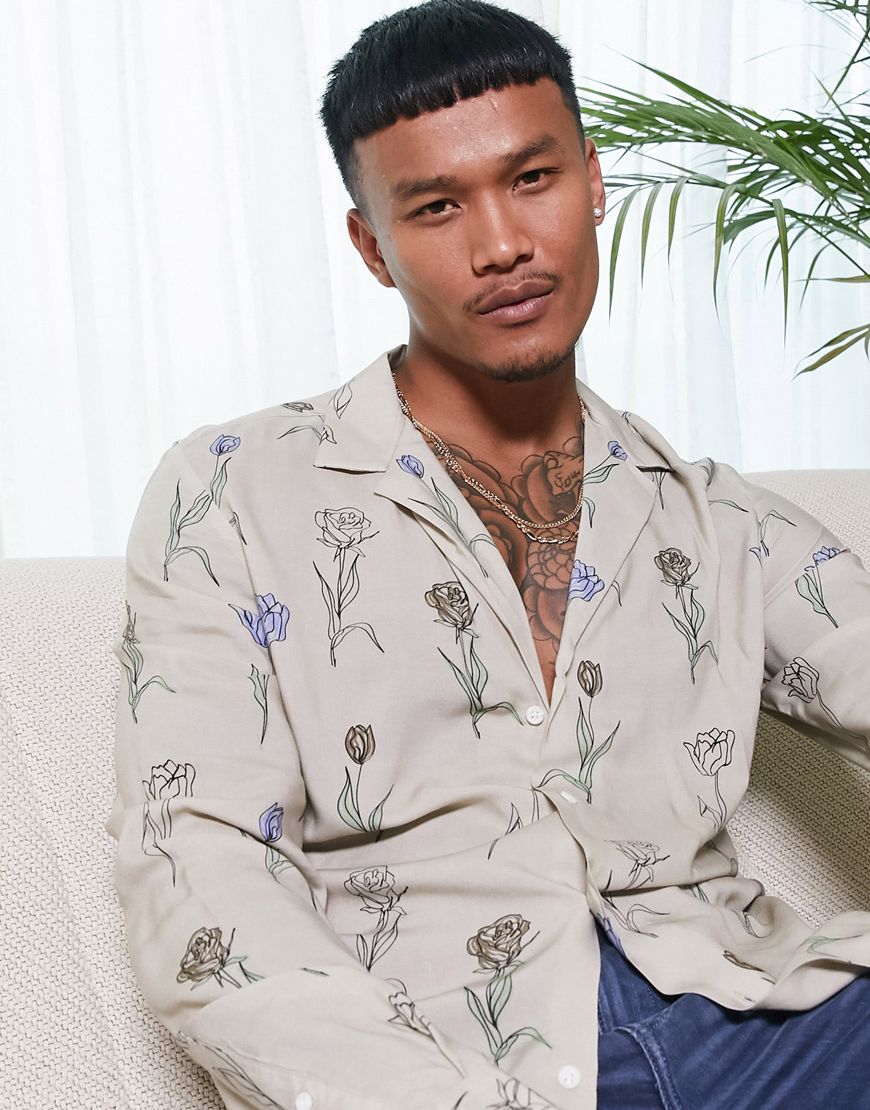 A picture of a model wearing a floral shirt.  Available at ASOS |ASOS Style Feed