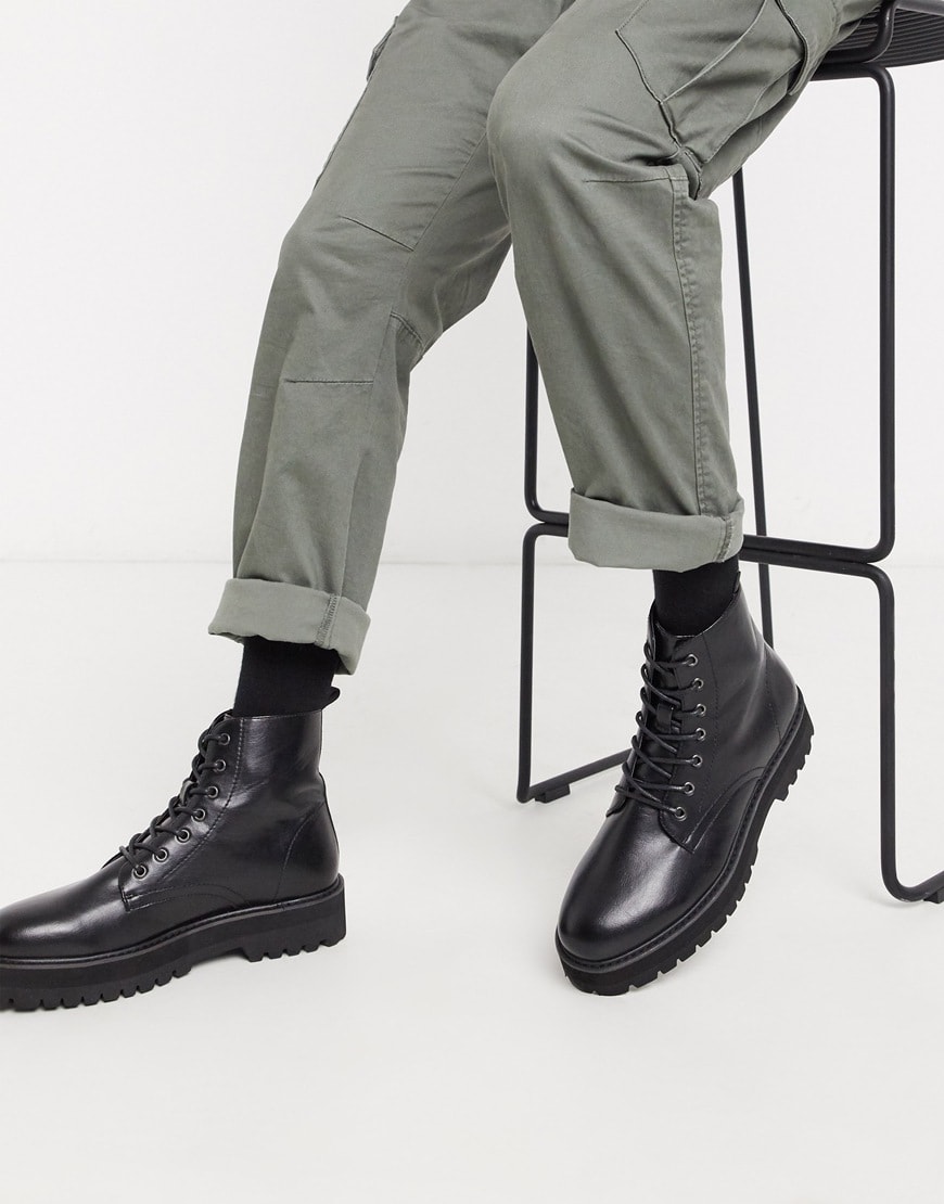 A picture of a model wearing faux leather boots.  Available at ASOS |ASOS Style Feed