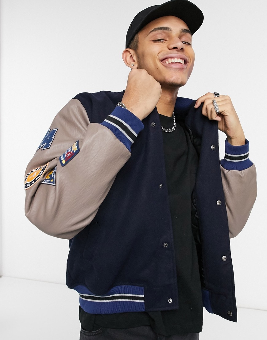 An image of a man wearing a navy jacket by ASOS Design | ASOS Style Feed