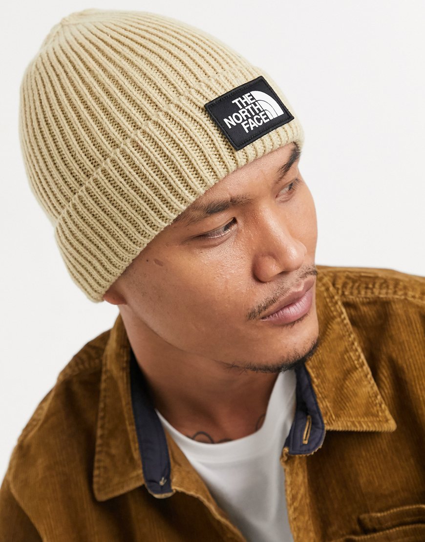 The North Face TNF Logo box cuffed beanie in beige | ASOS Style Feed