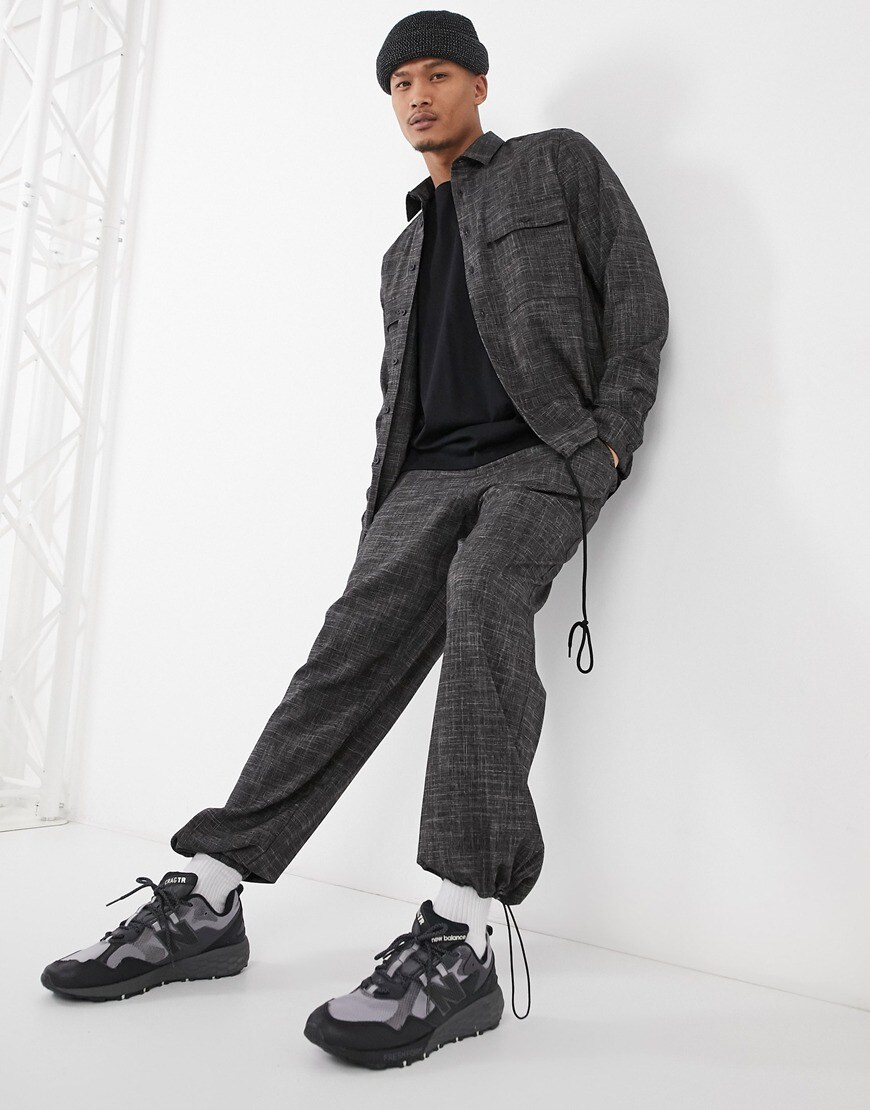 An image of a man wearing a grey jacket and trousers by ASOS Design | ASOS Style Feed