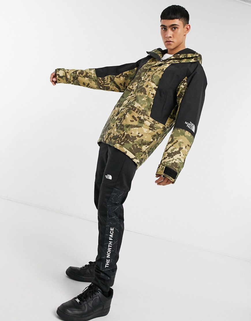 An image of a man wearing a camouflage print coat by The North Face | ASOS Style Feed