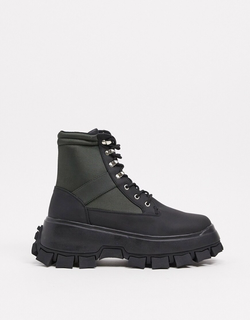 ASOS DESIGN lace up boots in black faux leather with khaki panels on chunky cleated sole