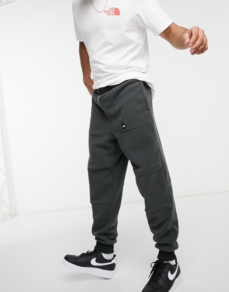Model wearing Nike Tech Fleece joggers in black