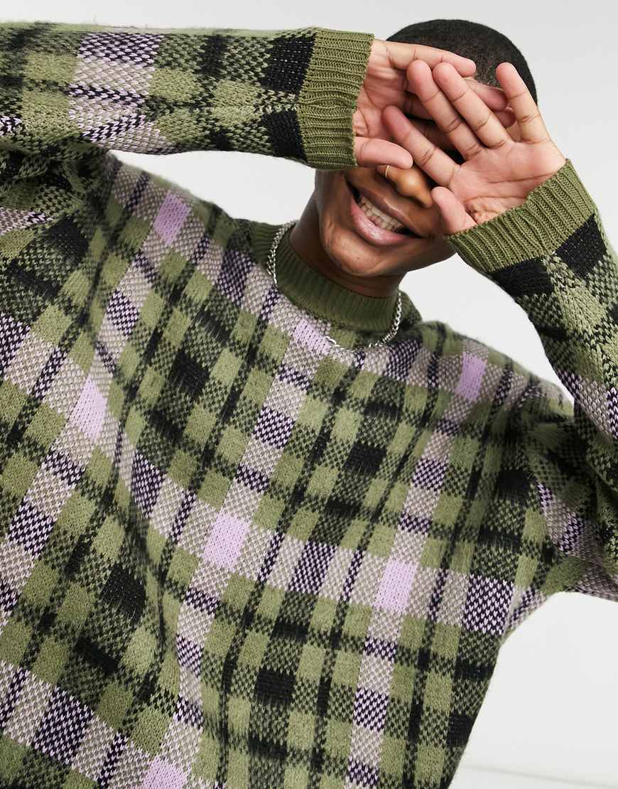 Model wearing ASOS DESIGN textured knit check roll neck sweater in green