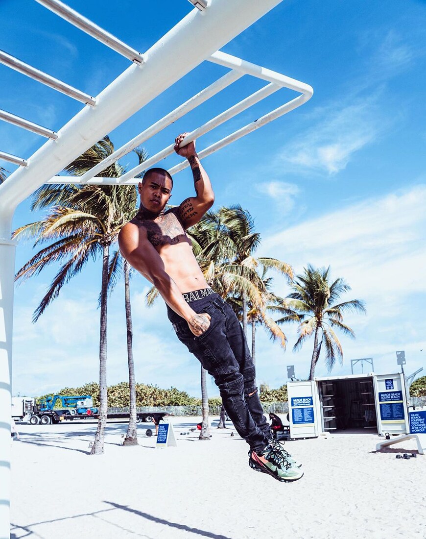 A picture of Cyrus Marinay working out on a beach