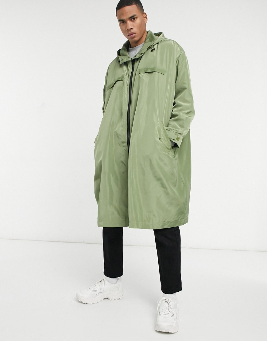 An image of a man wearing a green coat by ASOS Design| ASOS Style Feed