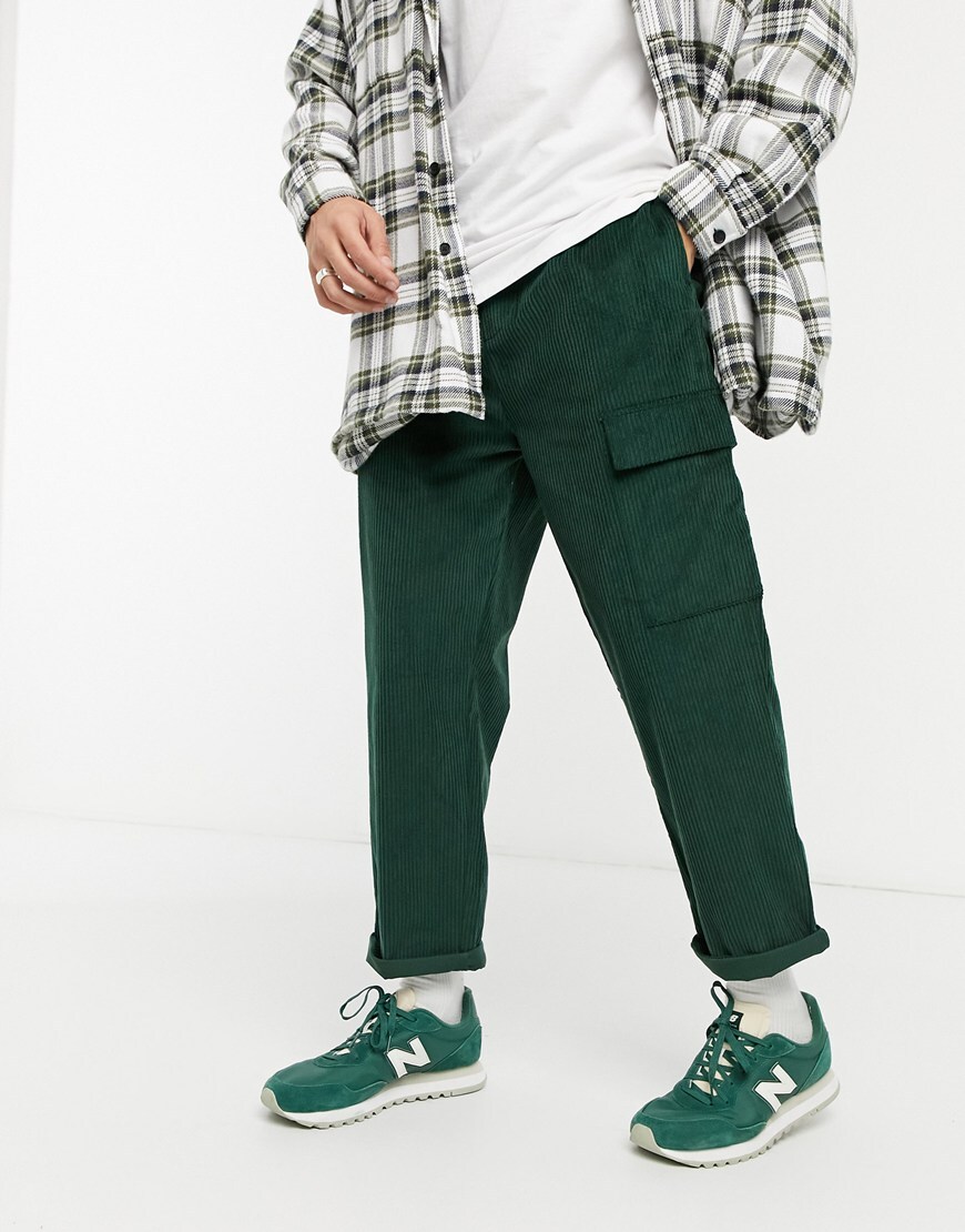 An image of a man wearing a pair of cord skater-fit pants by ASOS DESIGN | ASOS Style Feed