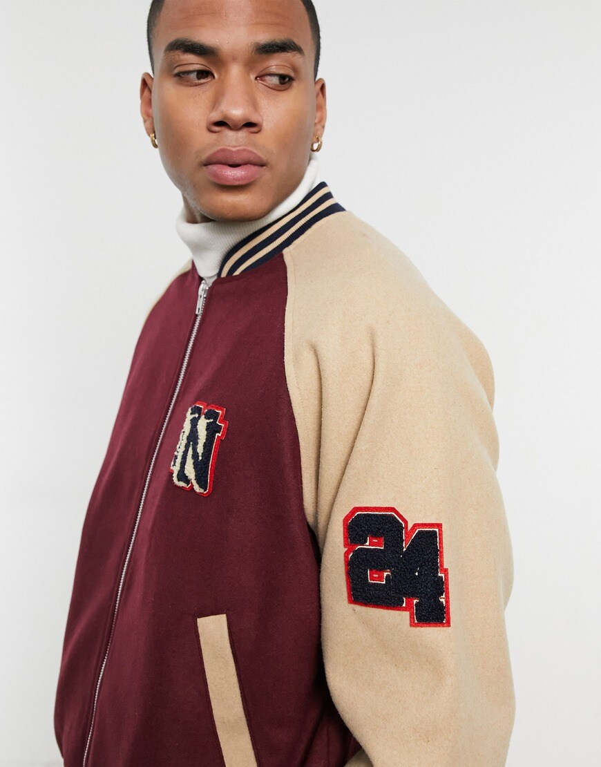 An image of a man wearing a varsity jacket by ASOS DESIGN | ASOS Style Feed