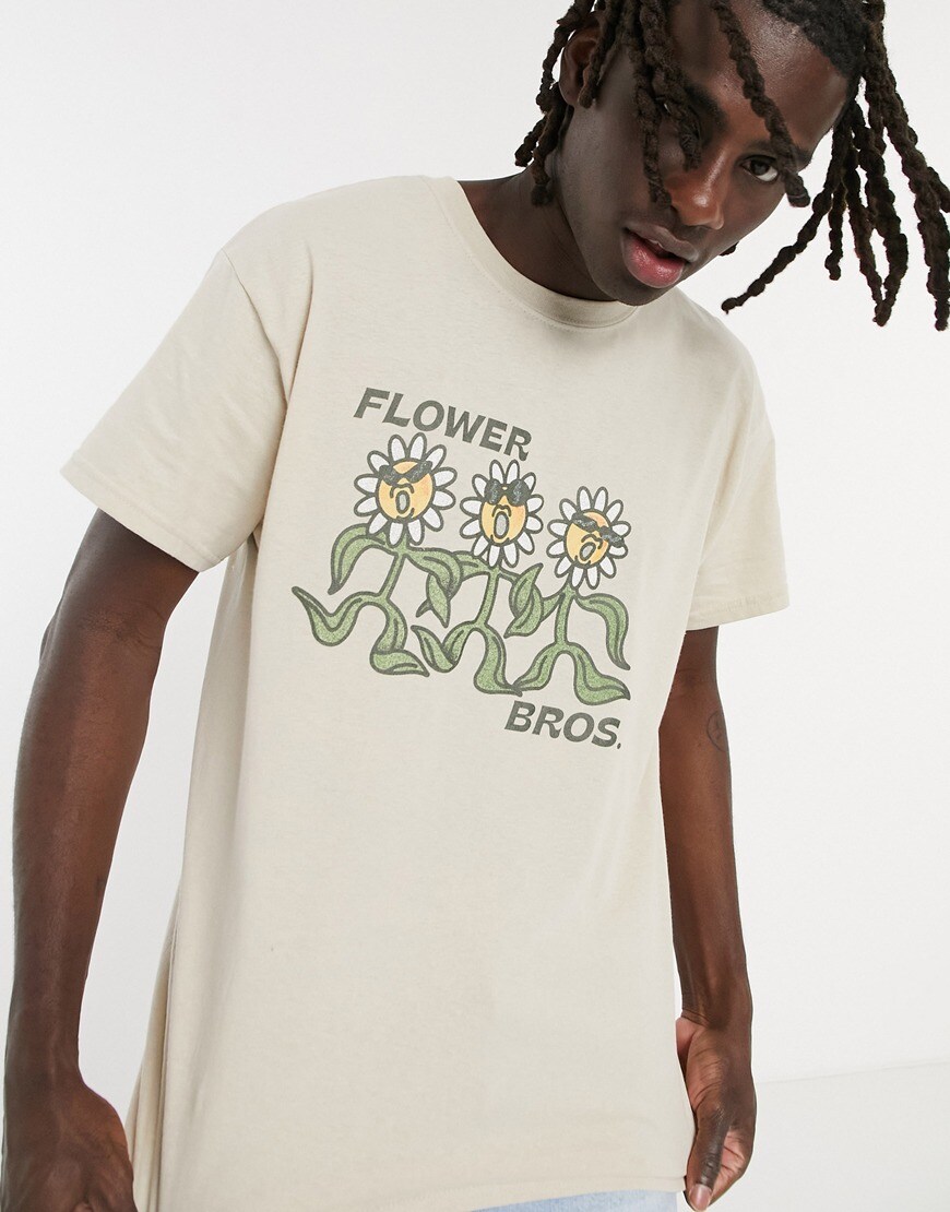 An image of a man wearing a flower print T-shirt by ASOS Design | ASOS Style Feed