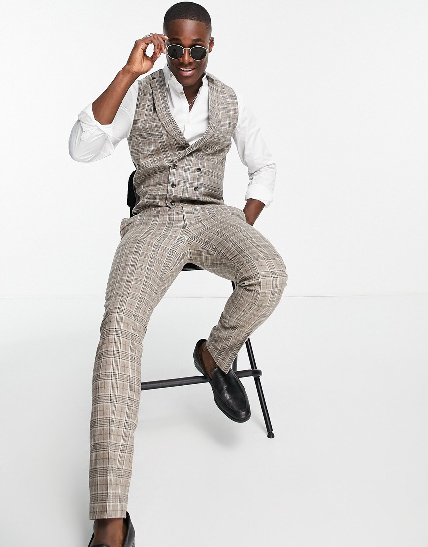 Model wears nicely tailored checked trousers in greys, whites and beiges. | ASOS Style Feed