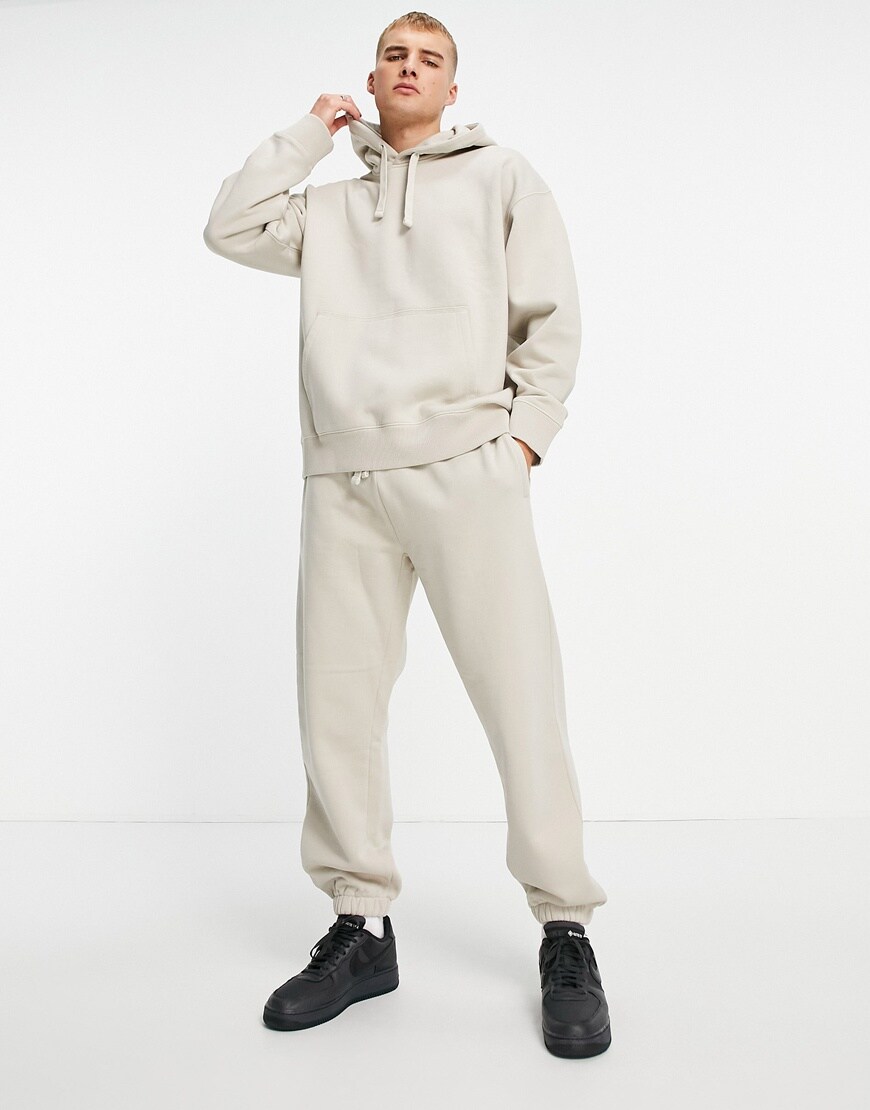 A picture showing a model wearing stone joggers. | ASOS Style Feed
