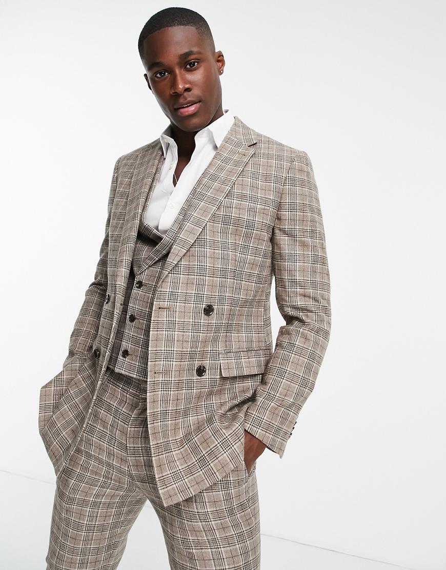 Model wears a three-piece suit with a checked pattern. The suit is made of greys, beiges and whites. | ASOS Style Feed