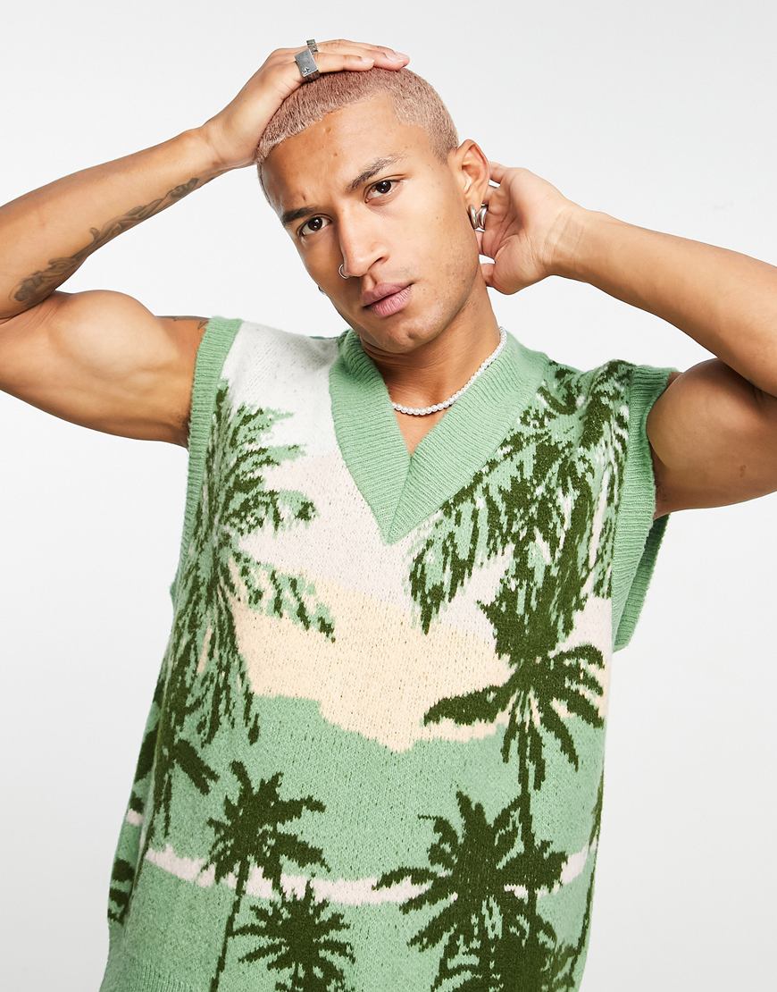 Man in a palm tree print sweater vest.