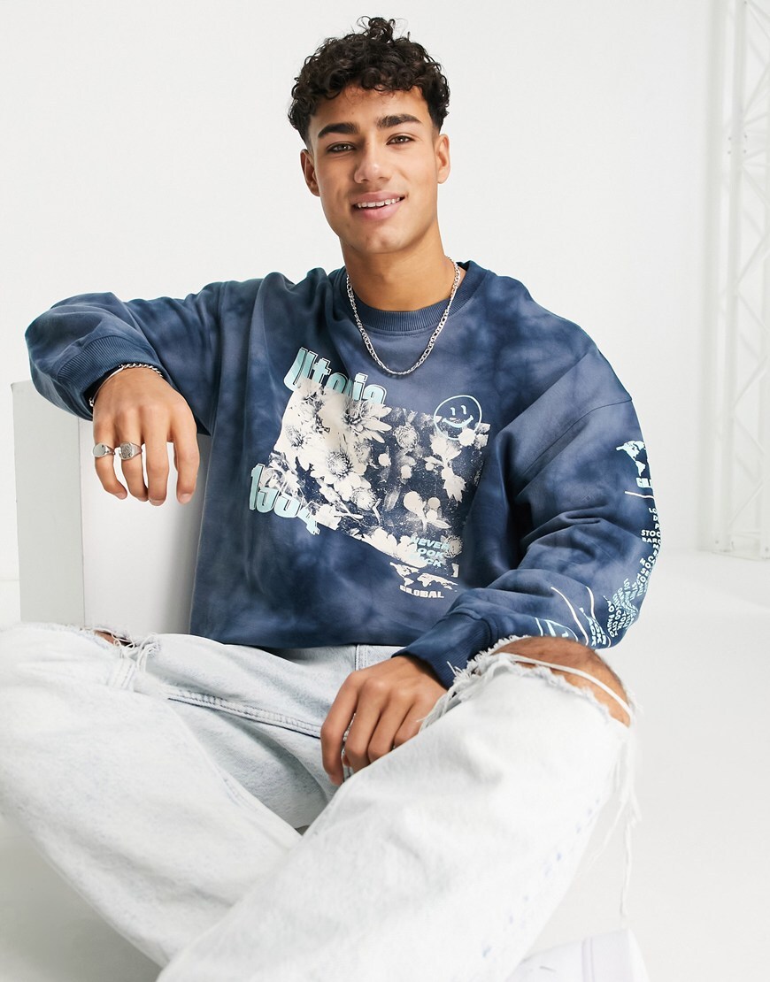 Man in a graphic print sweater.