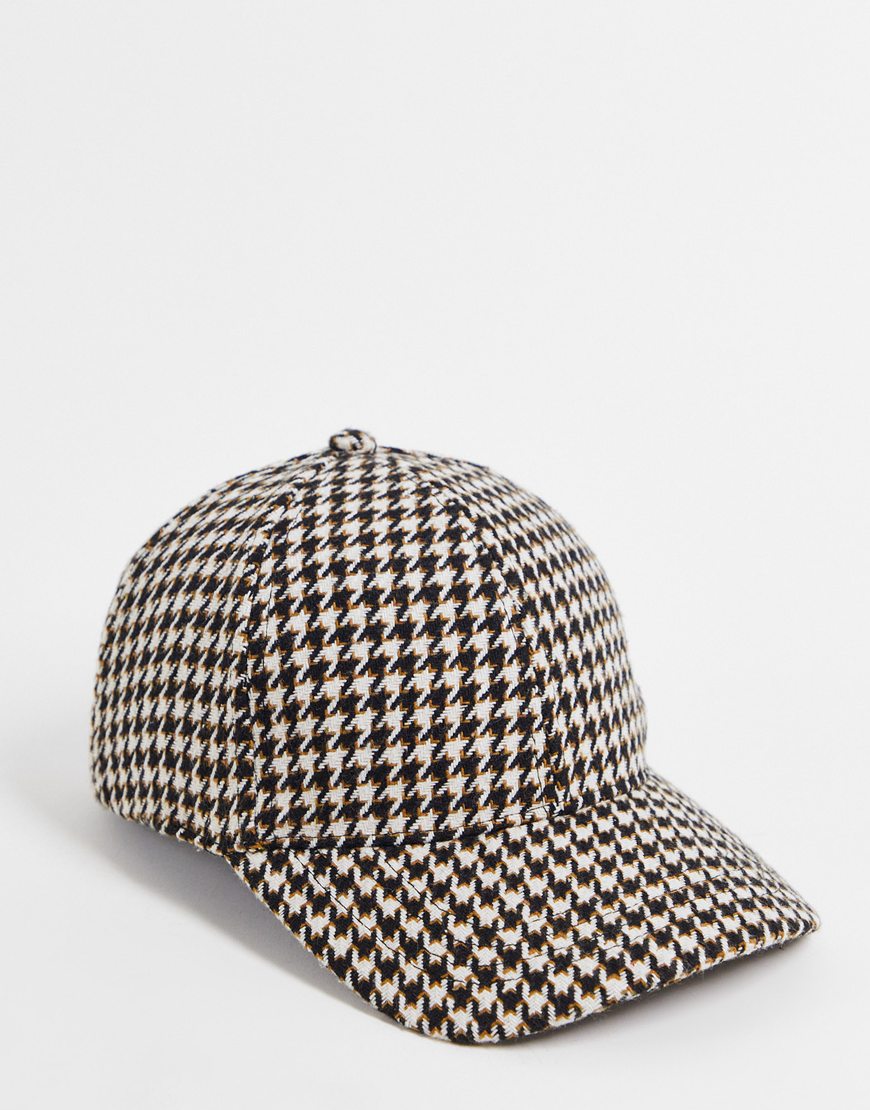 A houndstooth print cap.