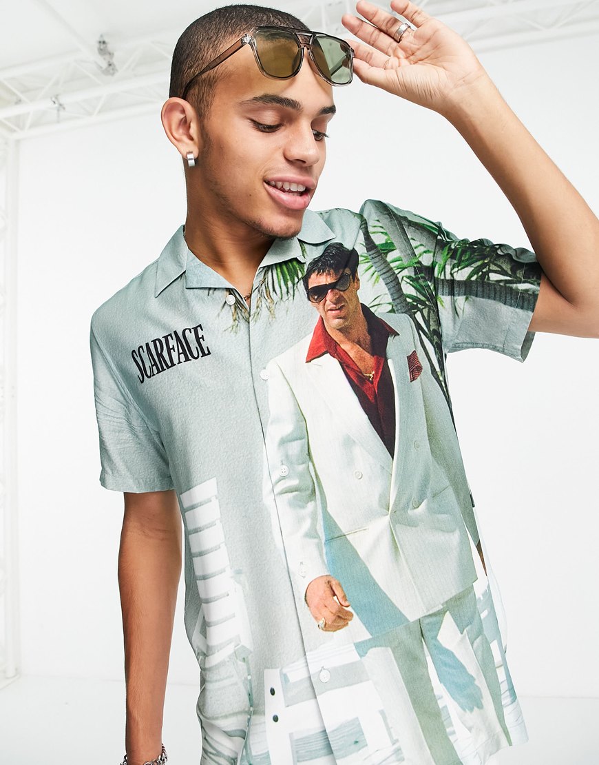 Man wearing a Scarface print shirt.