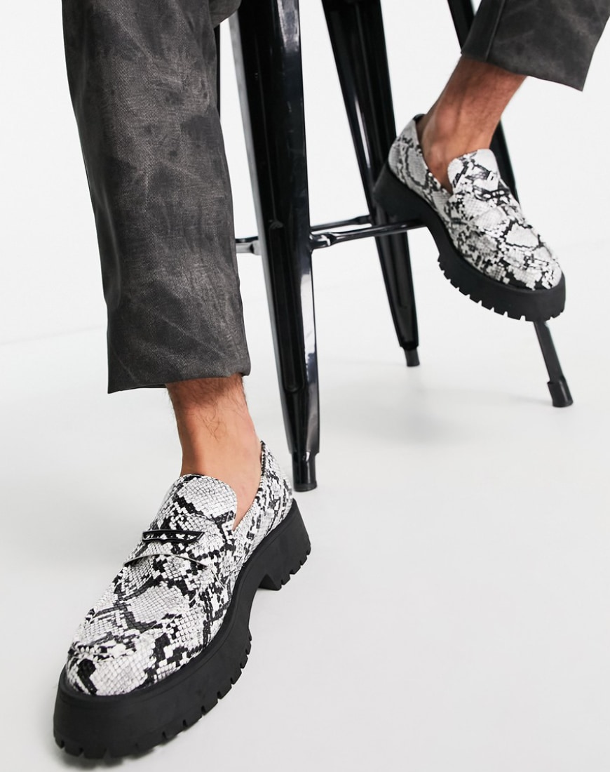 A pair of faux snakeskin loafers.