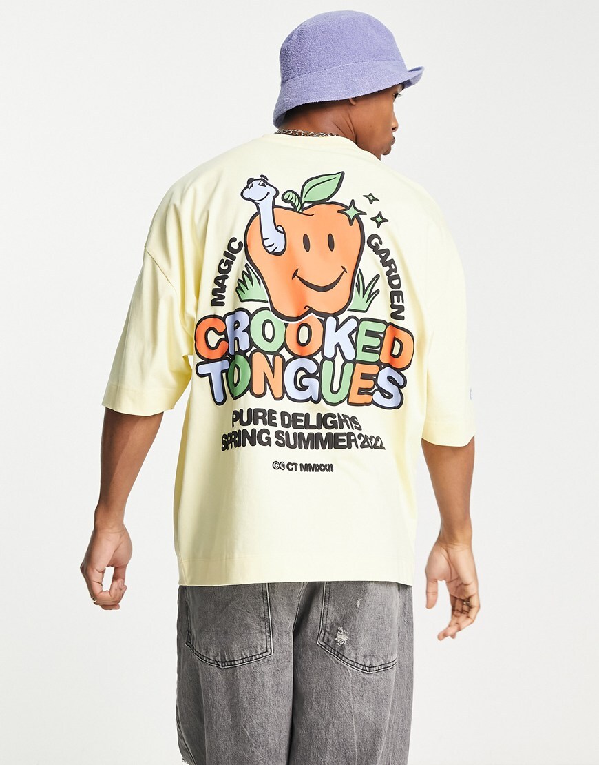 Crooked Tongues oversized t-shirt with apple graphic print in yellow | ASOS Style Feed