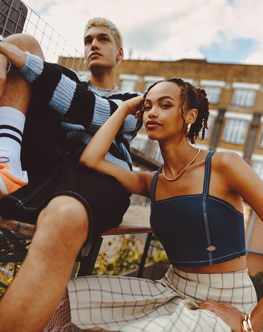 A man and a woman wearing grunge-inspired outfits
