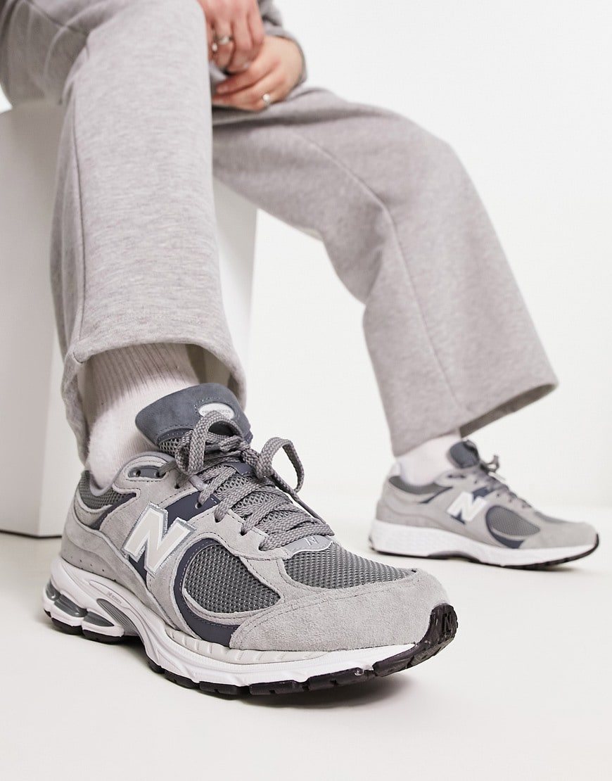 model wearing grey sneakers