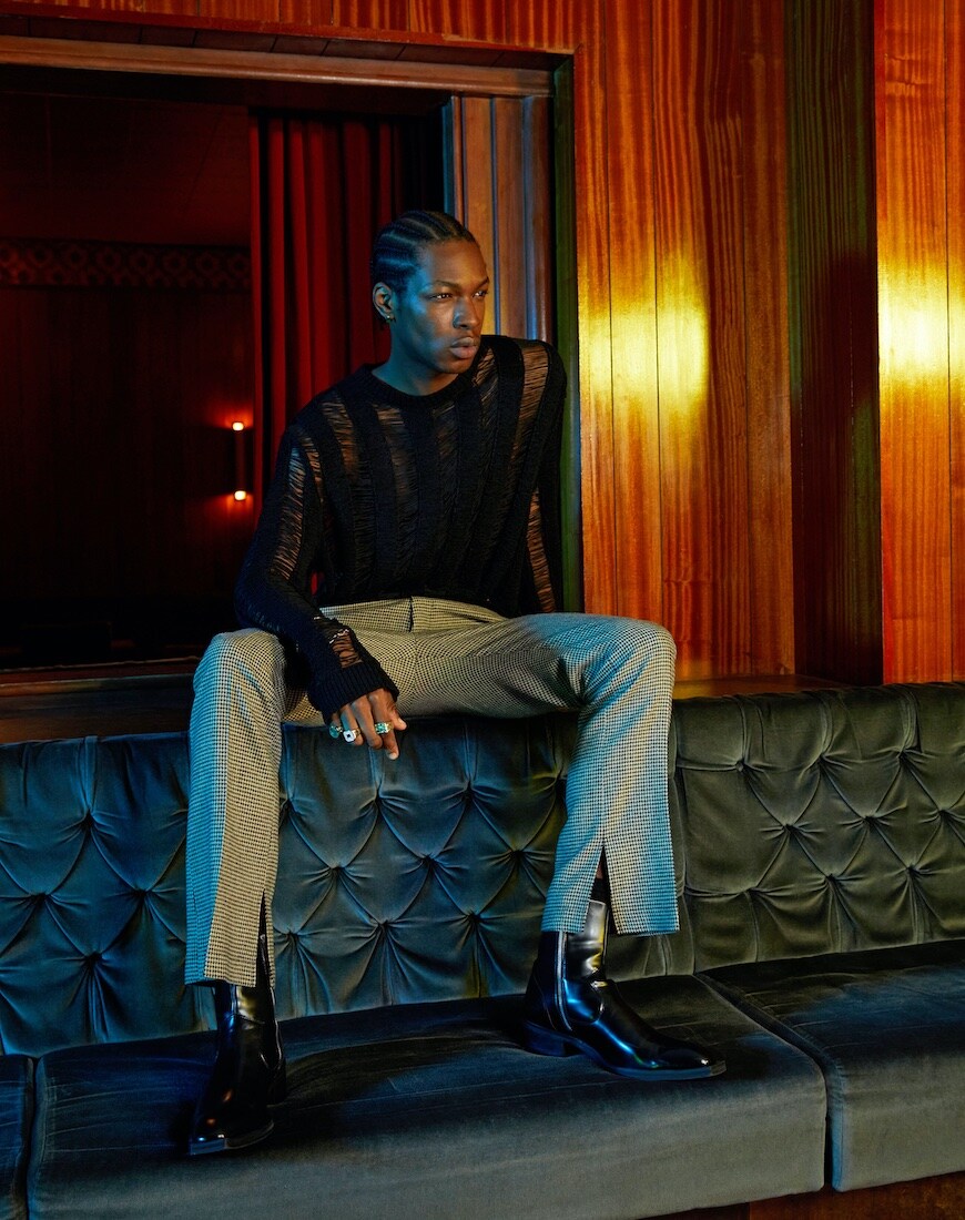 Ripped jumper and smart trousers