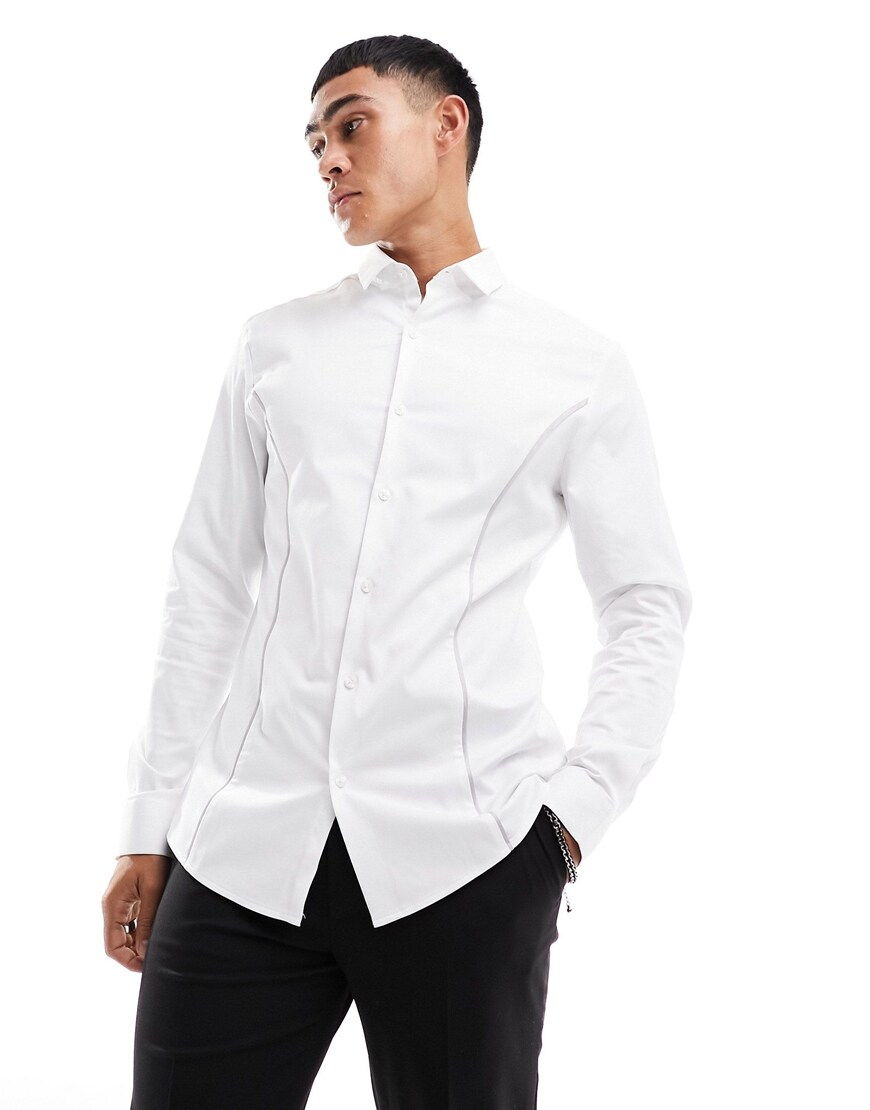 A model wearing a white shirt 