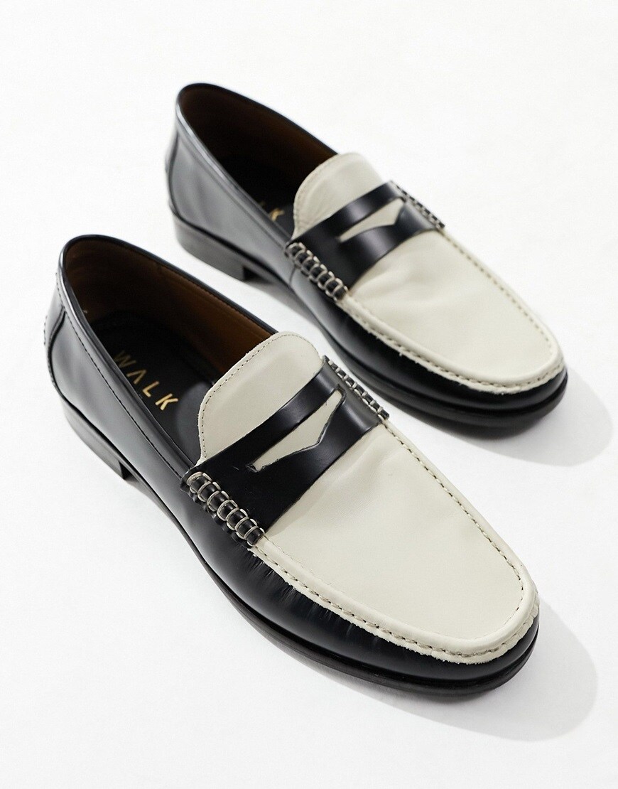 A pair of black and white smart loafers