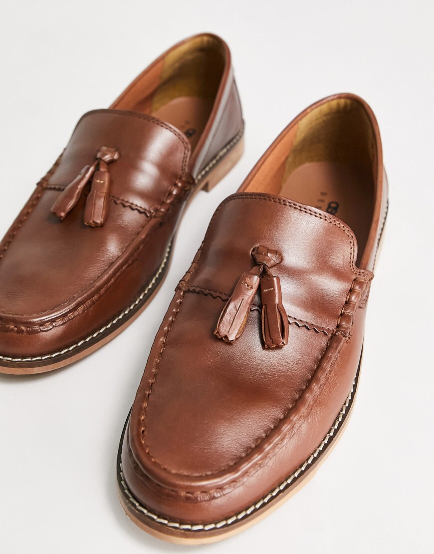 A pair of brown tassel loafers