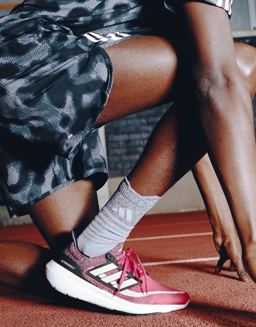 model wearing adidas sneakers